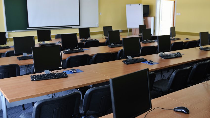 brand new computer with monitor in classroom