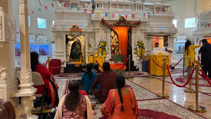 Members of a Hindu temple in Middletown participate in a ritual to the Goddess Lakshmi, a deity worshipped during Diwali.