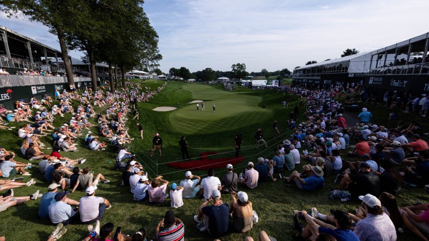 Jun 21, 2025; Cromwell, Connecticut, USA; General view on the 18th hole as Denny McCarthy and Austin Eckroat prepare to play their putts during the third round of the Travelers Championship golf tournament. Mandatory Credit: Bill Streicher-Imagn Images