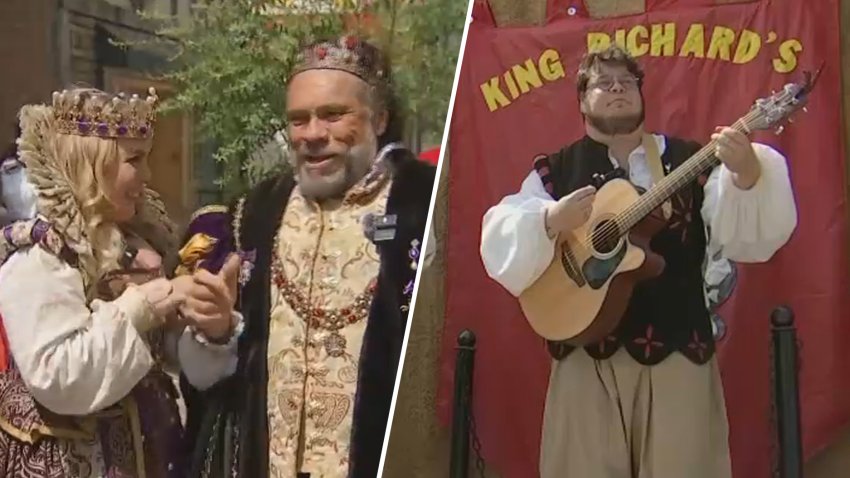 The queen, king and a musician at King Richard's Faire in Carver, Massachusetts.