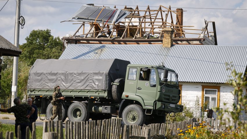 Police and army inspect damage to a house destroyed by debris from a shot down Russian drone in the village of Wyryki-Wola, eastern Poland, on September 10, 2025