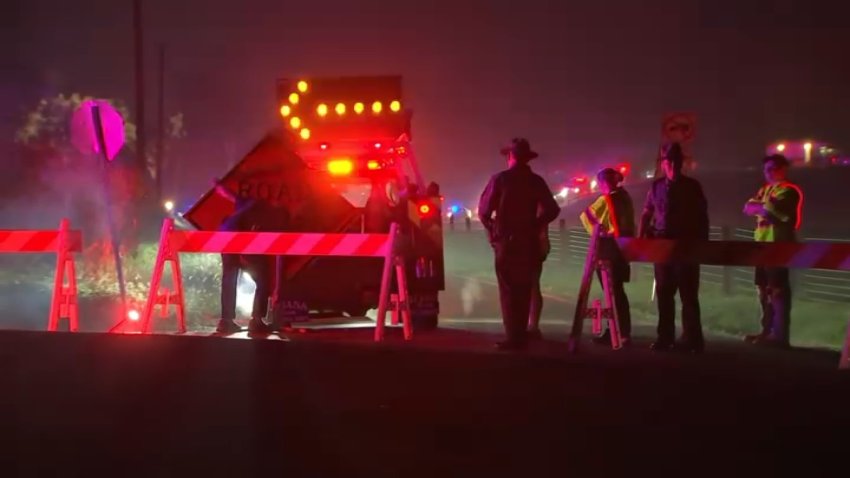 Police stand at a road closure near the scene where three police officers were killed in a shootout with a suspect in North Codorus Township in York County on Wednesday.