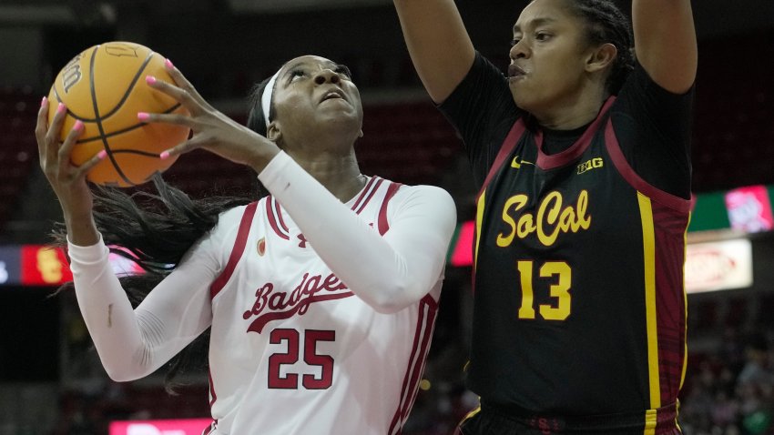 Wisconsin forward Serah Williams (25) is guarded by USC center Rayah Marshall (13) during the second half of their game Wednesday, February 5, 2025 at the Kohl Center in Madison, Wisconsin.