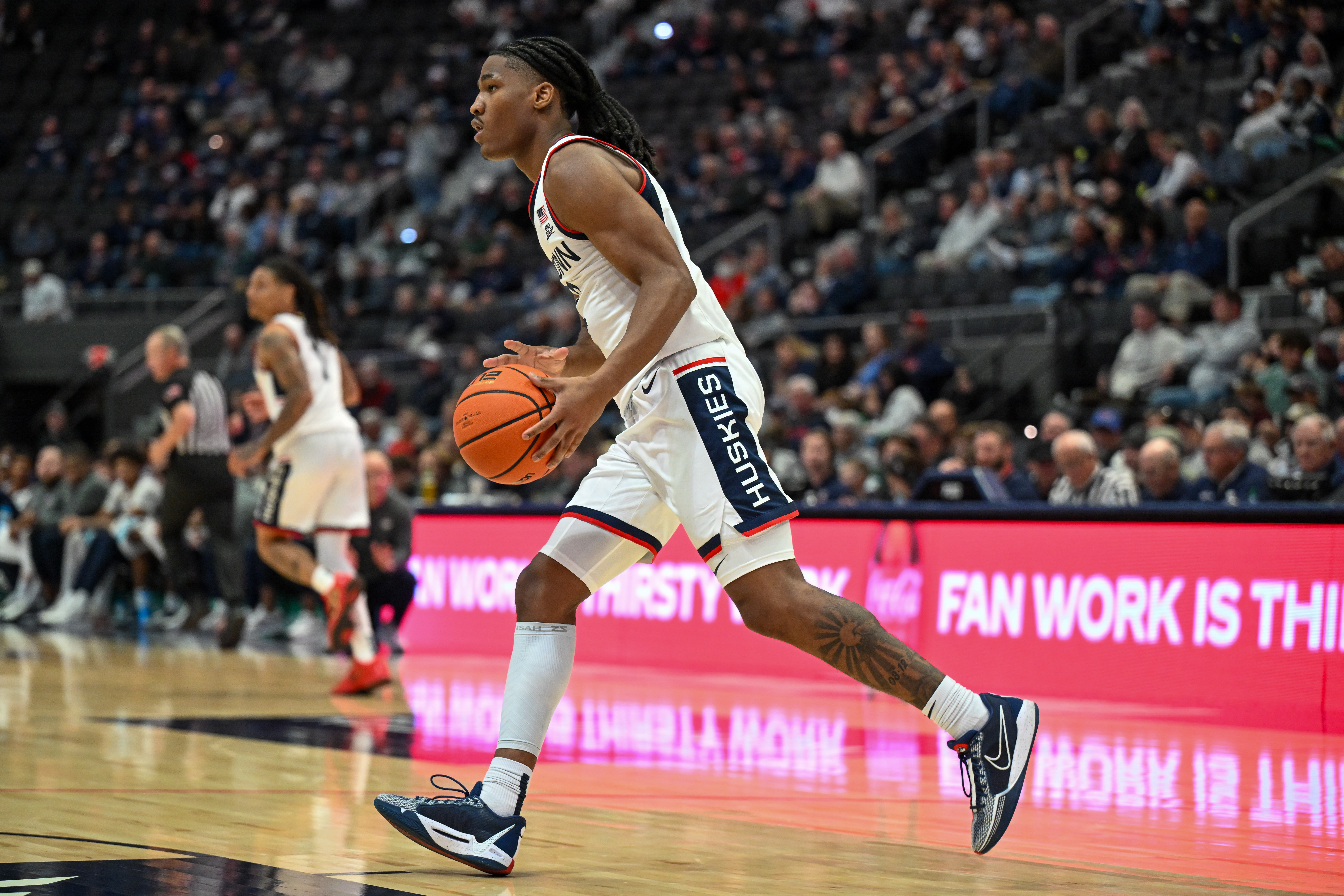 Oct 28, 2025; Hartford, CT, USA; Connecticut Huskies guard Silas Demary Jr. (2) dribbles the ball during the second half against the Michigan State Spartans at PeoplesBank Arena. Mandatory Credit: Mark Smith-Imagn Images