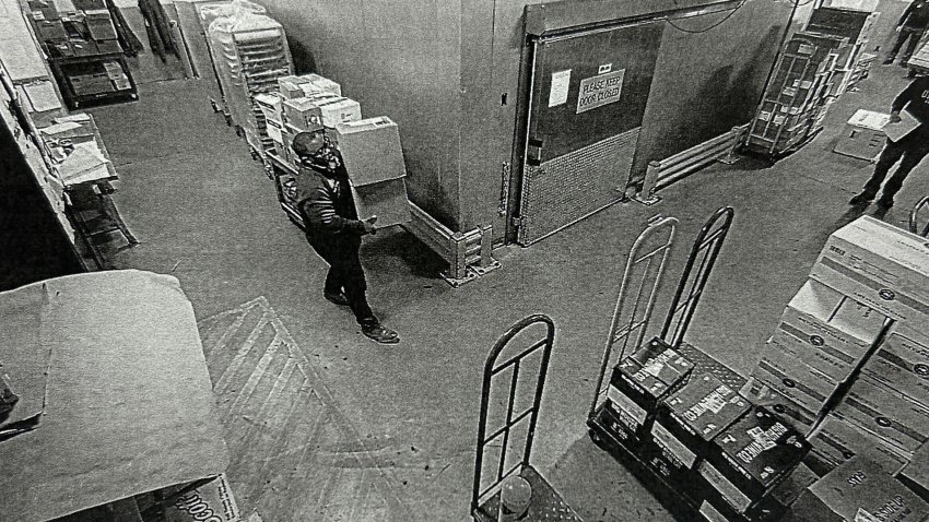 An image from the criminal complaint against Lamar Cook allegedly showing him carrying parcels of cocaine at a hotel.