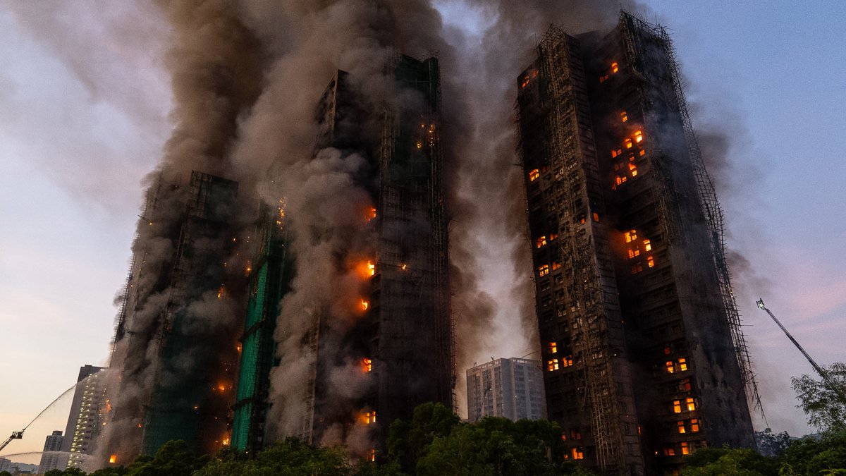 Death toll rises to 128 in Hong Kong fire as 8 more arrested over towers' renovation