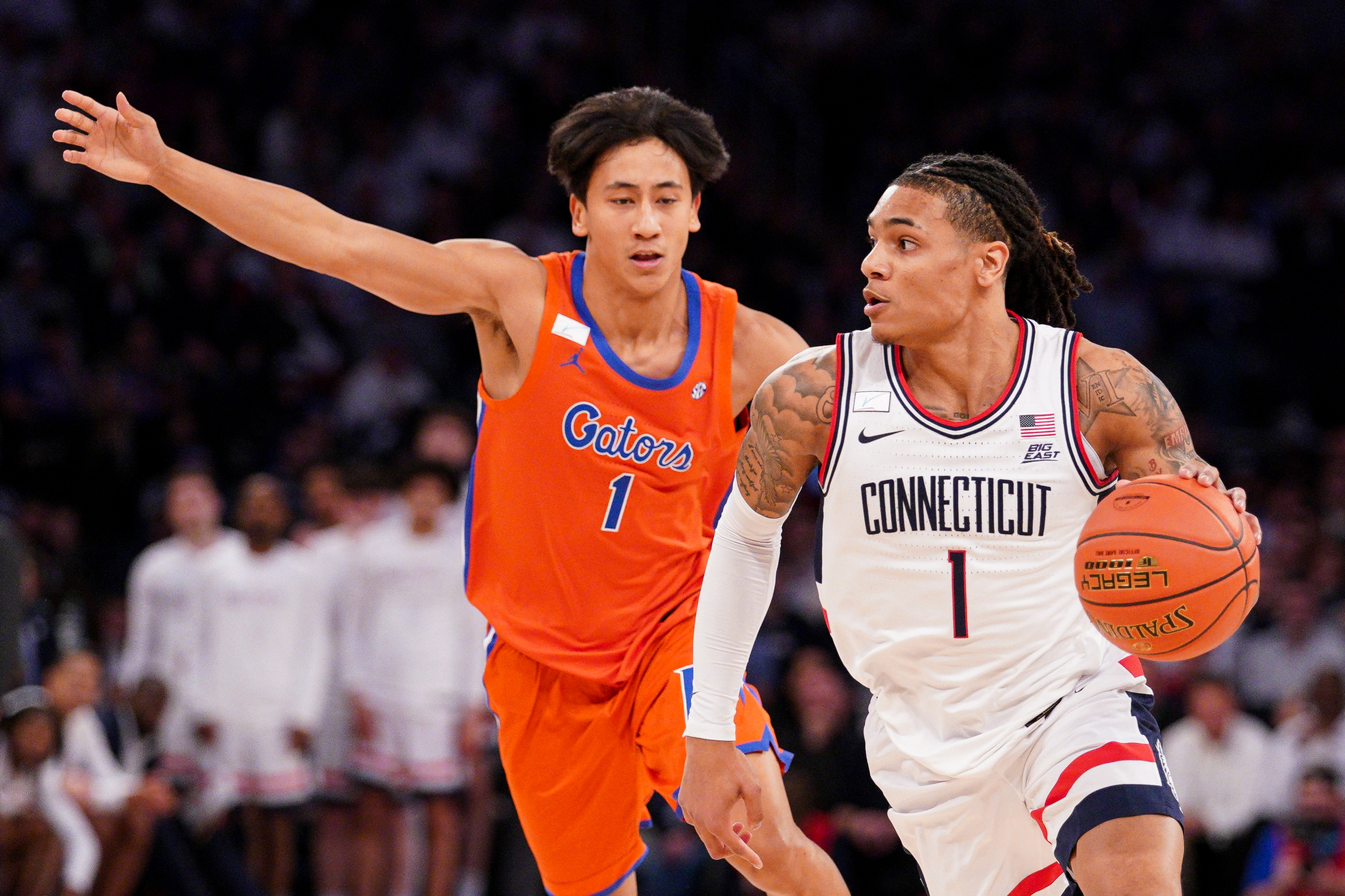 Ball scores 19 points as No. 5 UConn beats No. 18 Florida 77-73 in Jimmy V Classic