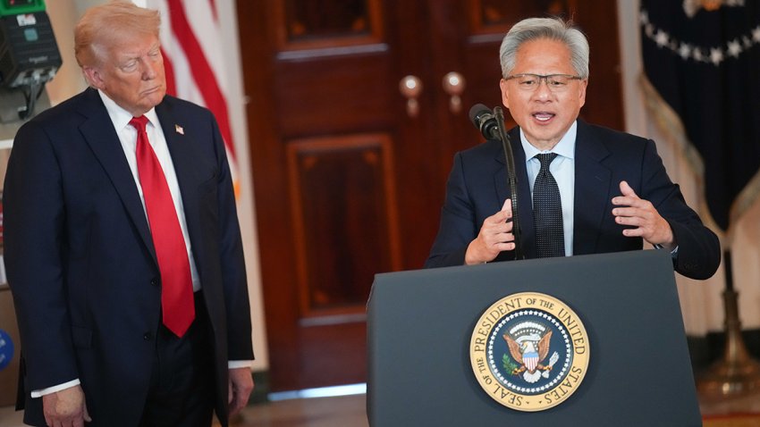 File - U.S. President Donald Trump listens as Nvidia CEO Jensen Huang speaks in the White House on April 30, 2025.