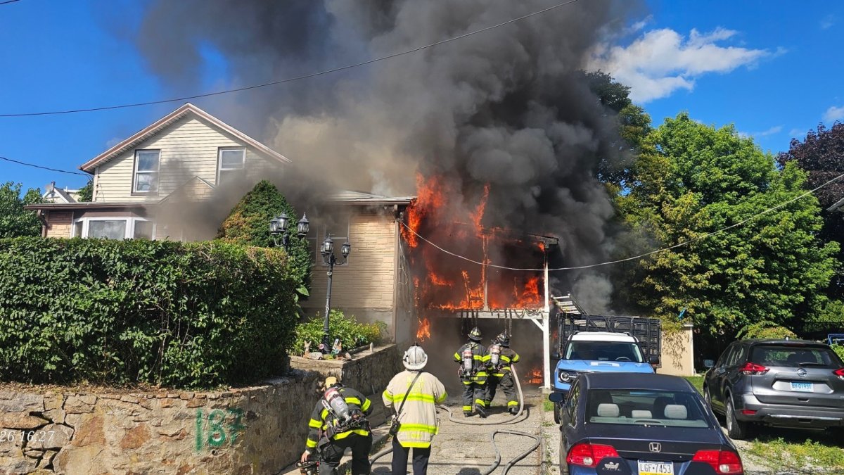 Teen jumps out of Norwalk multi-family home during fire, 1 firefighter ...