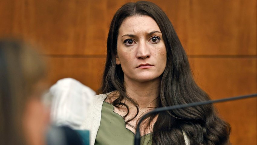Lindsay Clancy waits for Judge William Sullivan to call a prospective jury member into court on day three of jury selection in her triple murder trial in Plymouth Superior Court on Wednesday, July 22, 2026. She is charged with murdering her three young children in 2023 in their Duxbury, Massachusetts home.