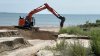 Heavy rain carves deep canyons into West Haven beach