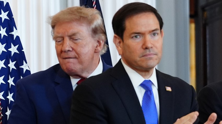 President Donald Trump walks past Secretary of State Marco Rubio as he arrives for a roundtable on the American mining industry, Friday, Aug. 7, 2026, at the State Department in Washington.