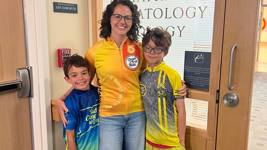 Jacqueline Santacroce with her sons Henry (left) and Owen (right) on August 10, 2026.