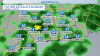 Showers through a cooler Sunday, a little breezy late tonight