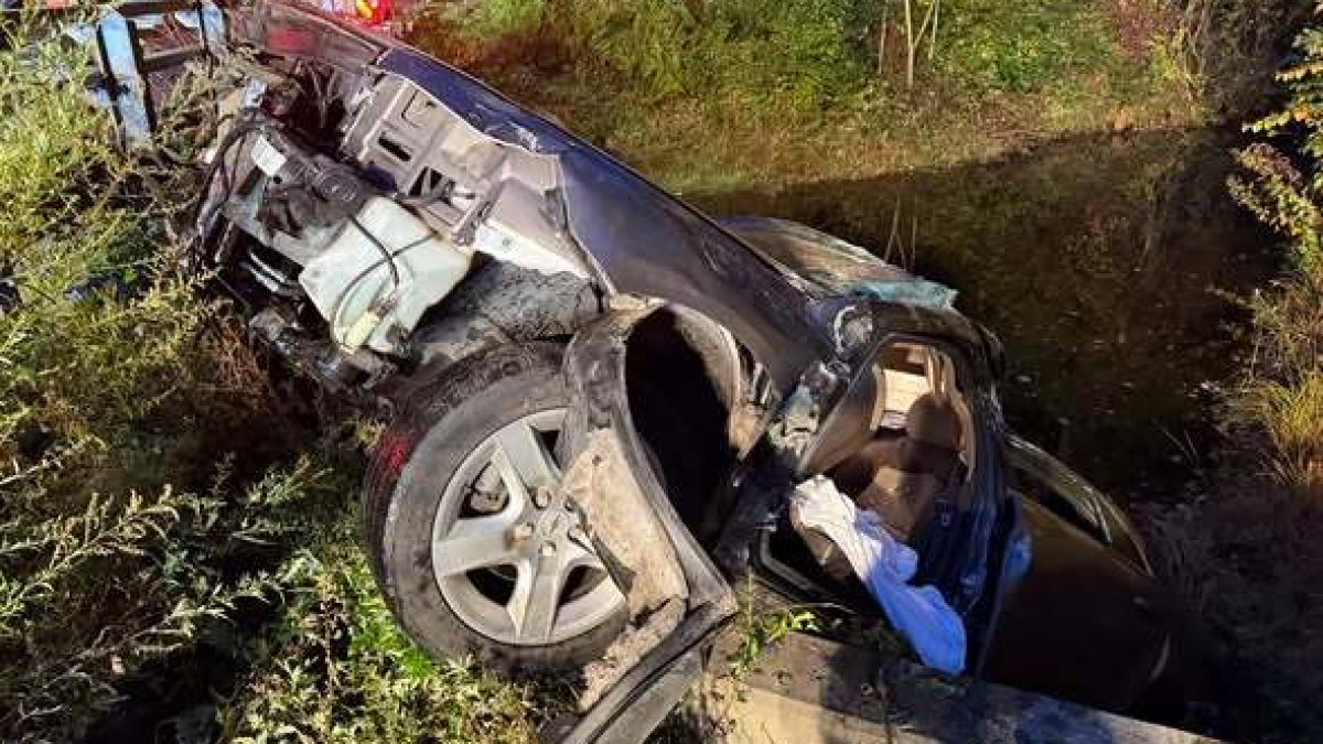 Firefighters rescue driver trapped in car submerged in Norwich brook