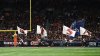 Service member dies after falling during pregame demonstration at college football game