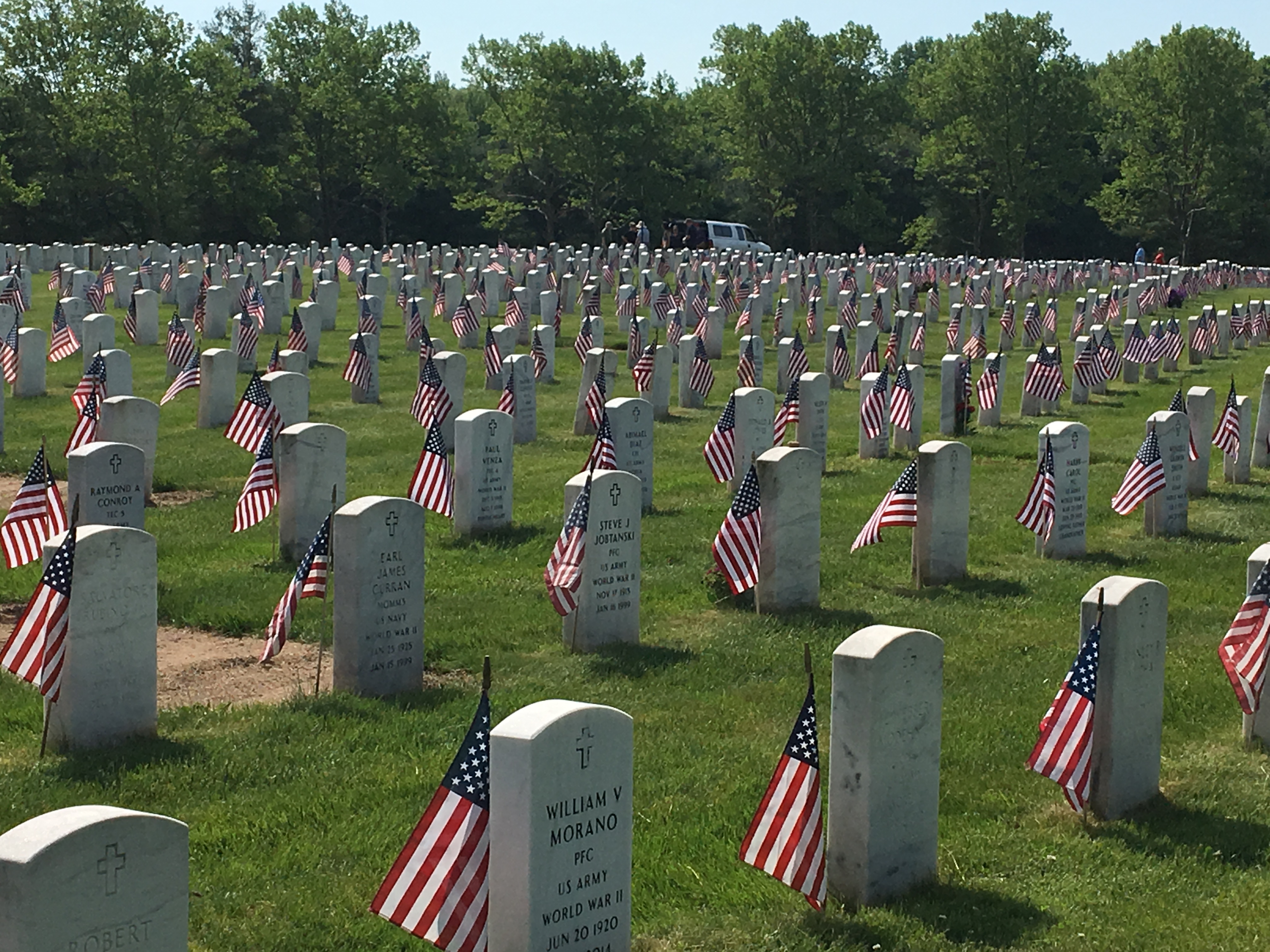 Hundreds of Volunteers Place Flags on Graves at Veterans Cemetery
